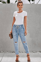Load image into Gallery viewer, Women ripped knee loose fitting baggie jeans with white waist strap
