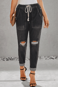 Women ripped knee loose fitting baggie jeans with white waist strap