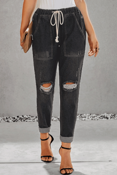 Women ripped knee loose fitting baggie jeans with white waist strap