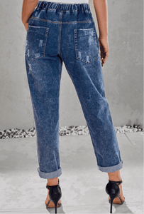 Women ripped knee loose fitting baggie jeans with white waist strap